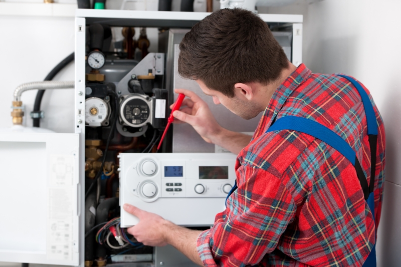 Gas Safe engineer working on a boiler in West Wickham
